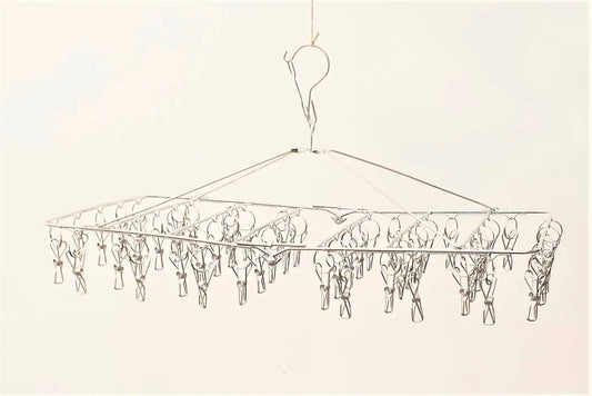 A drawing of a rectangular stainless steel compact peg hanger with 52 pegs, designed to be used for drying smaller items such as socks and underwear.